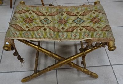 a small stool with a woven seat on top of it