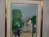 framed picture of a painting of a street with houses and trees