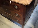 a wooden table with a knife on top of it