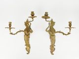 pair of antique brass wall sconces with figures on them