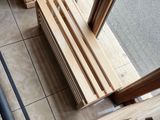 several pieces of wood are stacked on top of each other on the floor