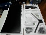 a white box with a black tablet inside of it