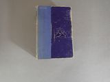 a blue book sitting on top of a white table