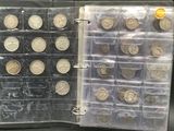 a lot of coins that are in a clear case