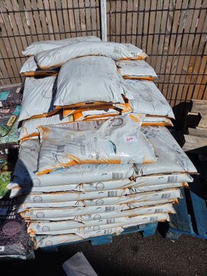 many bags of food sitting on top of a table