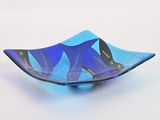 a glass bowl with a blue and black design on it