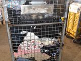 a large metal cage with a bunch of items inside of it