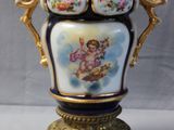 a vase that has a picture of an angel on it