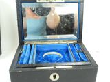 someone is taking a picture of a jewelry box with a ring in it