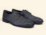 the man ' s shoes are blue and black on a white background