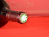 a bottle of wine that is sitting on a table