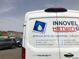 a white van with stickers on the side of it