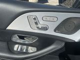 a close up of a car door with a speaker in it