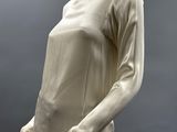 an image of a mannequin wearing a white top and pants