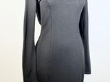 the dress is black and has long sleeves on it