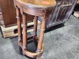 a wooden table with a wooden top in a room