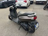 a scooter that is parked in a parking lot