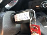 a keychain that is attached to a car ' s steering wheel