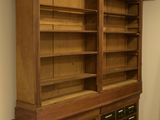 an image of a large wooden bookcase in a room