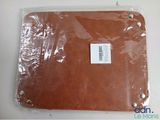 a picture of a piece of brown leather on a table