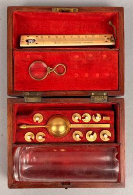 a wooden box with a set of tools inside of it