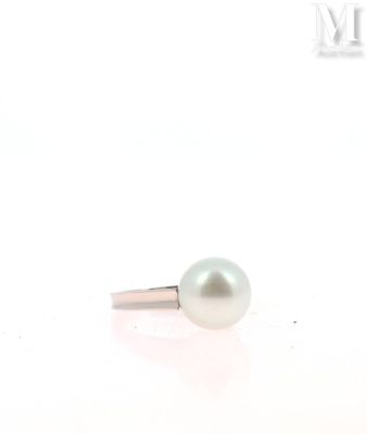 an image of a white pearl ring on a white surface