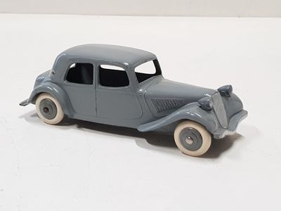 a toy car that is sitting on a white surface