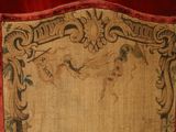 an old picture of a red frame with a bird on it
