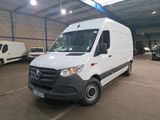 the white van is parked in a large warehouse with other vehicles
