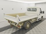 a white truck that is parked in a garage