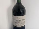 a bottle of wine that is sitting on a table