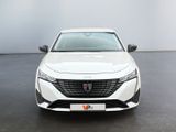 the front view of a white car in a white room