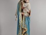 a statue of a woman holding a baby in her arms