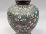 a vase that is sitting on a white surface