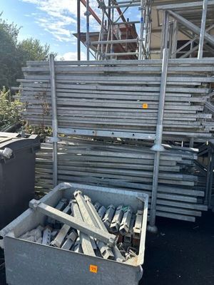 a lot of metal items in a bin outside