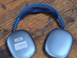 an image of a pair of headphones sitting on top of a wooden floor