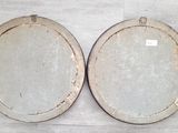 two white plates sitting on a table with a white table cloth