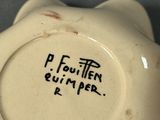 a close up of a white bowl with writing on it
