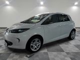 a picture of a white car parked in a garage