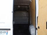 a white van with a bed in the back of it