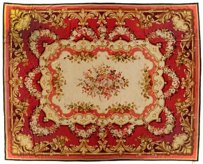 un gros plan d'un tapis rouge et doré sur fond blanc