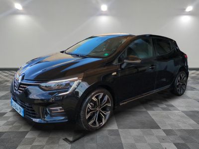 a black car parked in a garage with a checkered floor