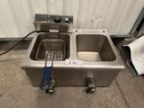 an image of a stainless steel sink with a drainer