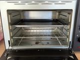 an open oven with the door open on a table