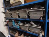 many bins on the shelves in the garage