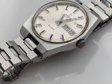 a watch that is sitting on a white surface