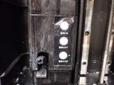 a close up of a machine with buttons on it ' s side