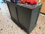 a counter with a stuffed animal on top of it