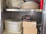 a stainless steel shelf with a bunch of items on it
