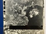a black and white photo of an aerial view of a city